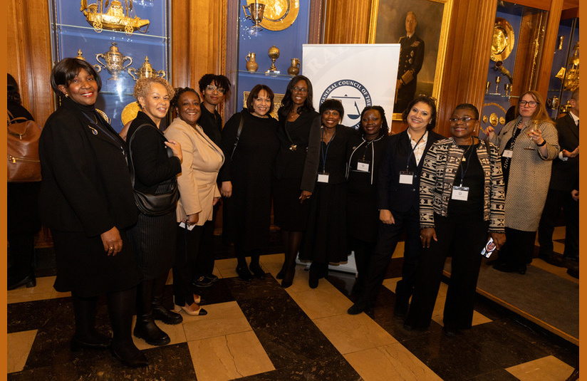 A photo of a group of people smiling at the camera