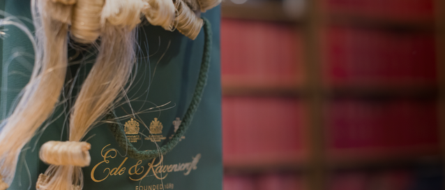 A photo of a barrister's wig in an Ede and Ravenscroft bag in a chambers room 