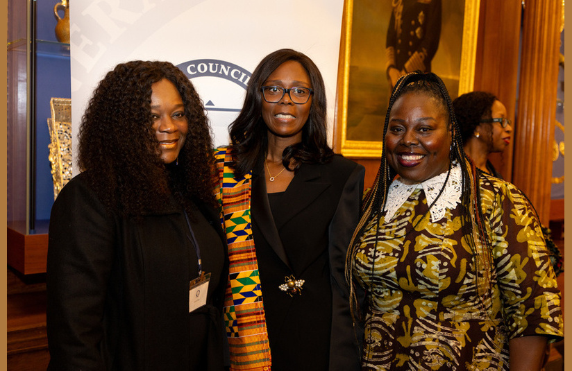 A photo of three people looking at the camera