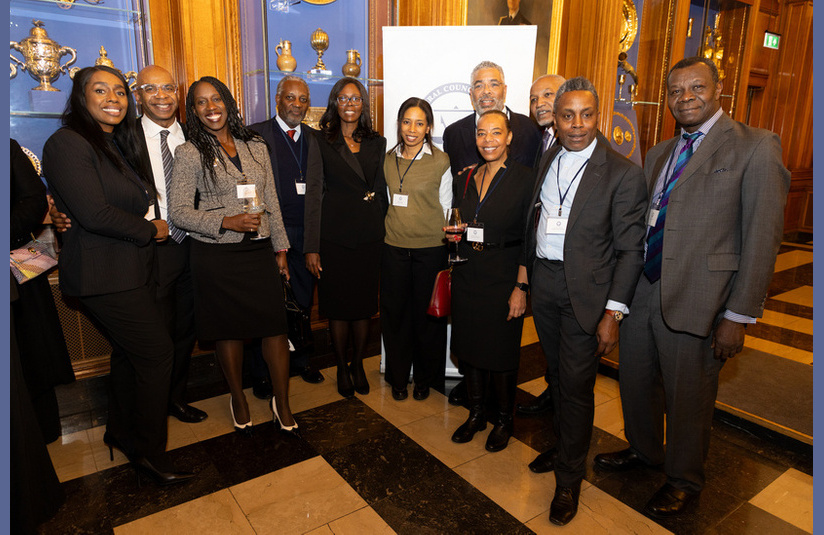 A photo of a group of people smiling at the camera