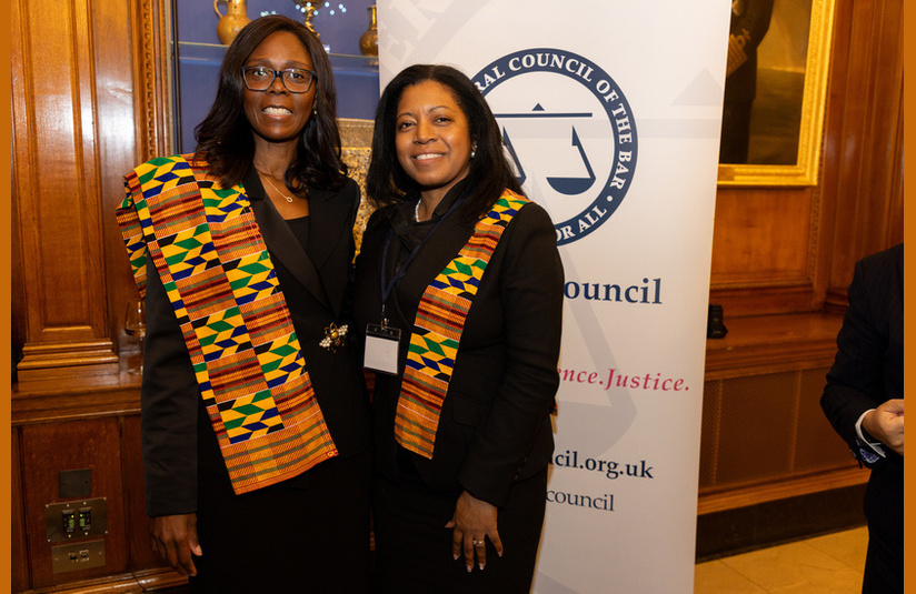 A photo of two people smiling at the camera