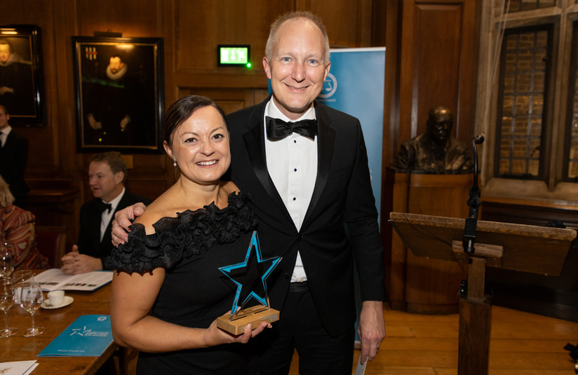 A photo of Fiona Butler with her award and the Chair of the Bar