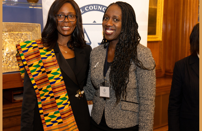 A photo of two people smiling at the camera