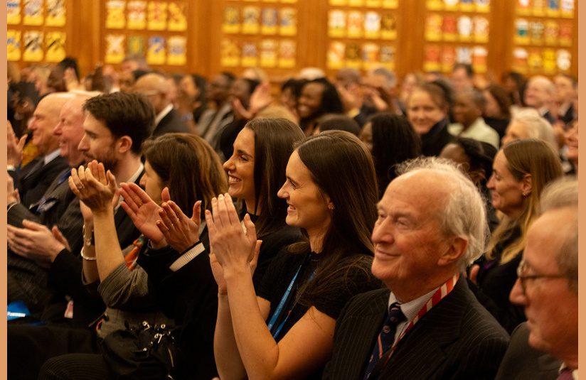 A photo of an audience clapping 